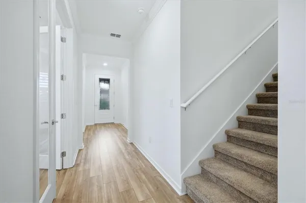 a view of entryway with wooden floor