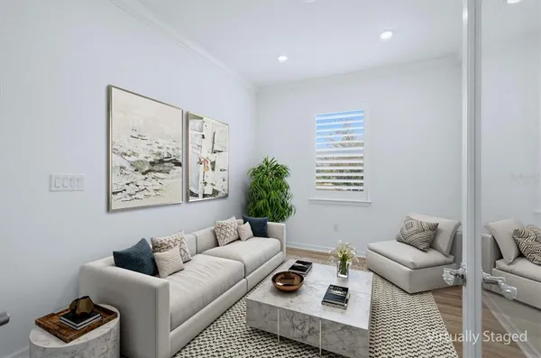 a living room with furniture and a window