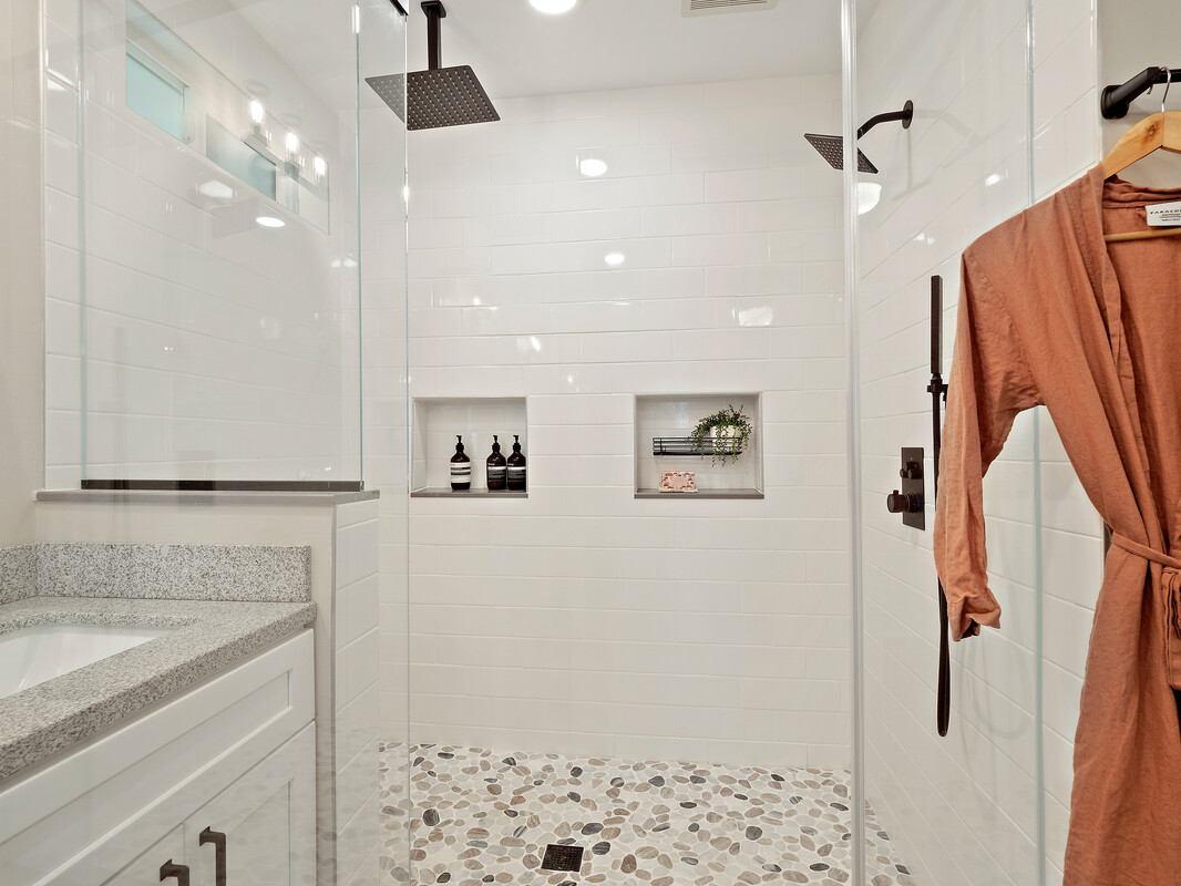 18-4050 North Oshiro Road Mountain View, HI 96771 - Photo 13 of 30 a bathroom with a sink a mirror and shower