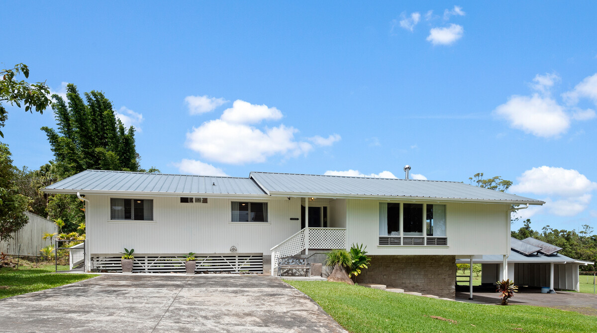 18-4050 North Oshiro Road Mountain View, HI 96771 - Photo 28 of 30 a front view of a house with garden