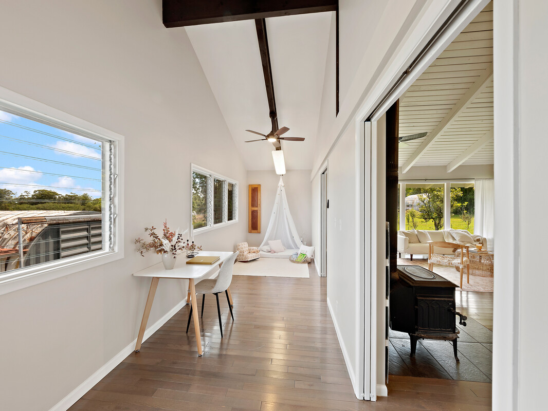 18-4050 North Oshiro Road Mountain View, HI 96771 - Photo 8 of 30 a view of a dining room with furniture window and wooden floor