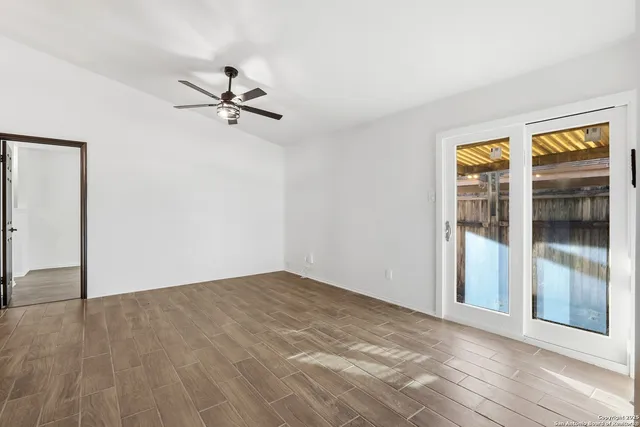 an empty room with fan