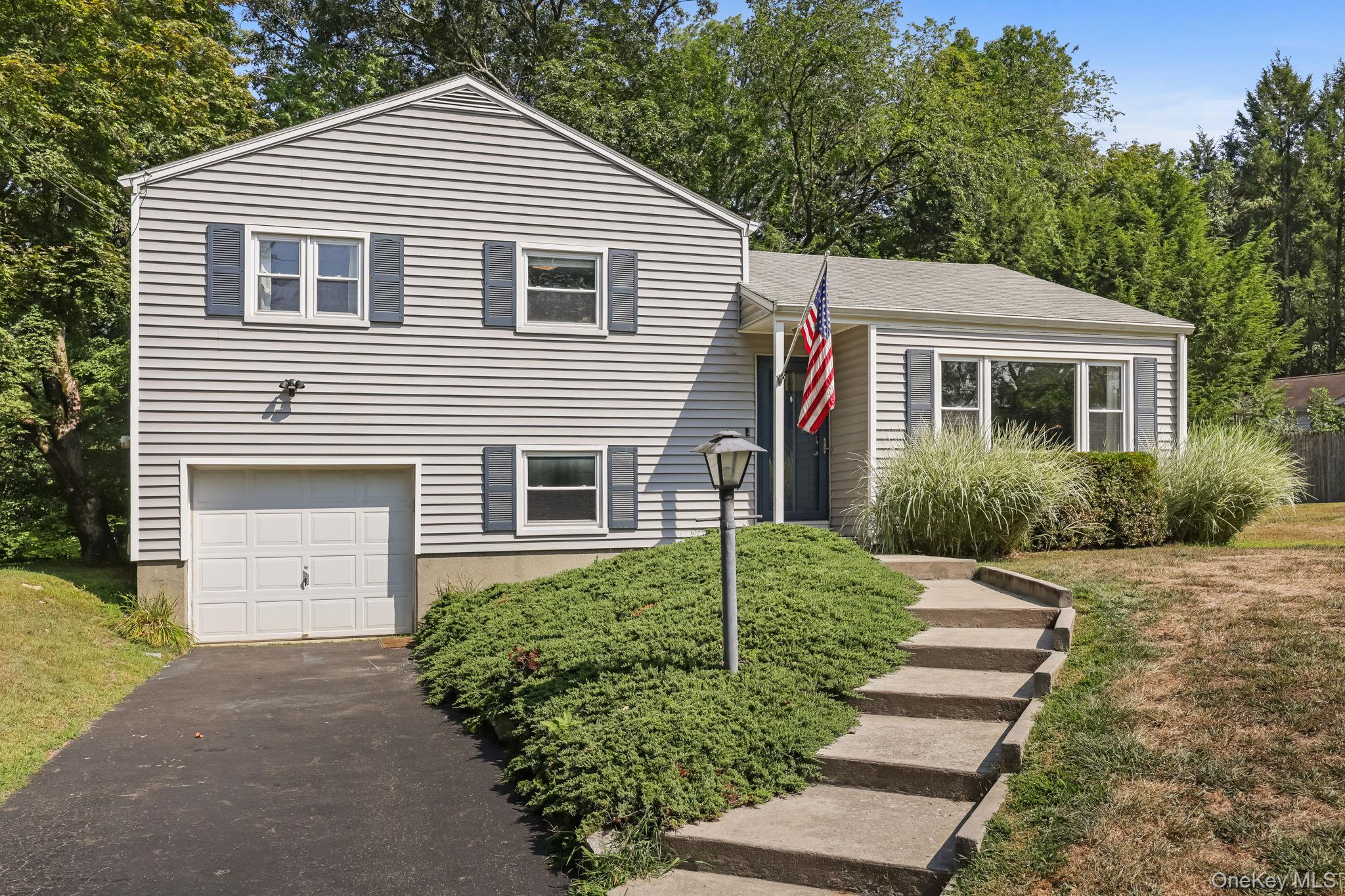 2434 Mill Pond Road Yorktown Heights, NY 10598 - Photo 1 of 1 a view of a house with a yard