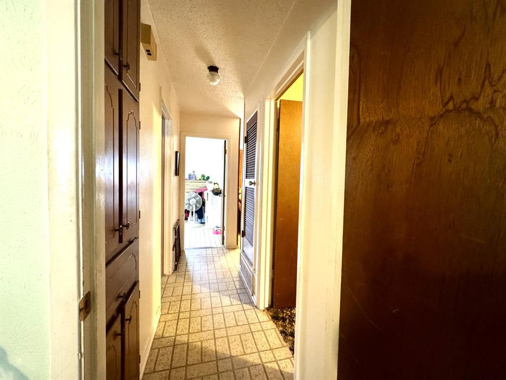 317 North Trail Street Crowley, TX 76036 - Photo 20 of 35 a view of a bathroom from a hallway