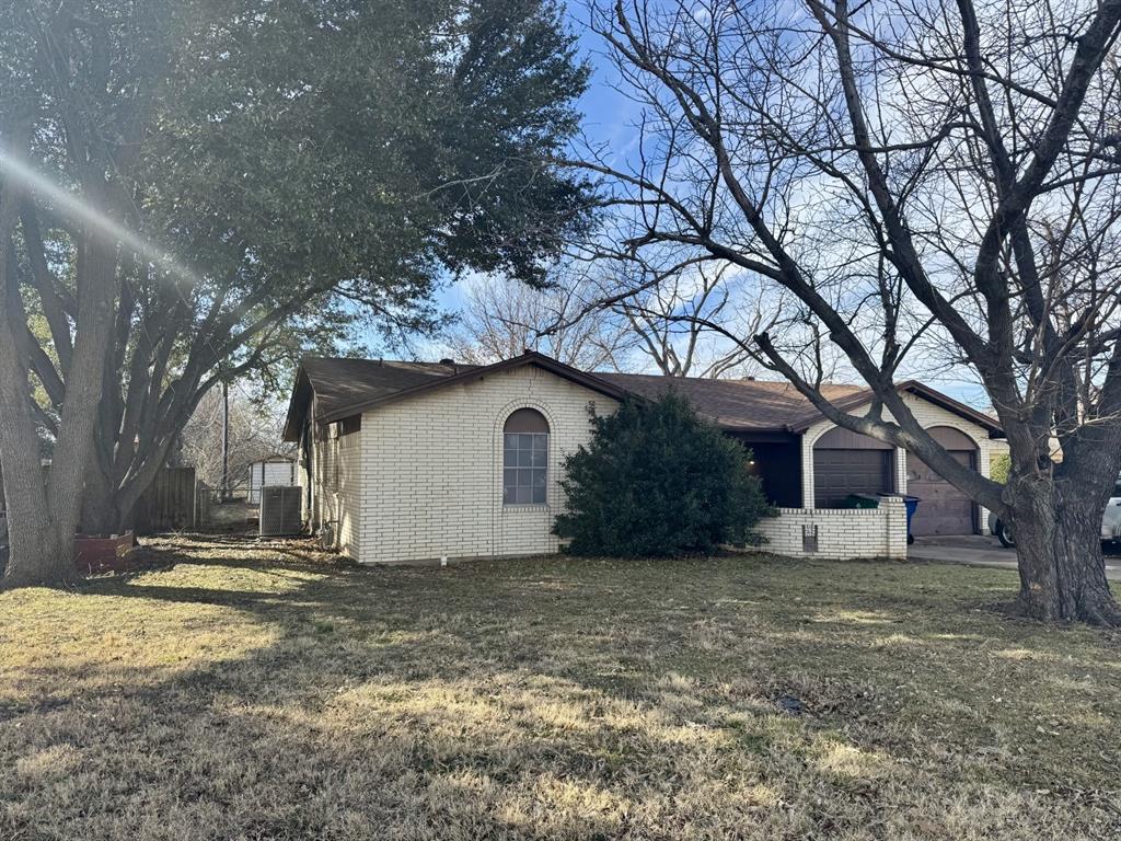 317 North Trail Street Crowley, TX 76036 - Photo 3 of 35 a house that has a tree in front of it