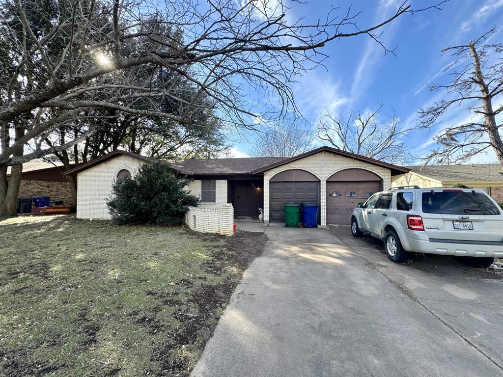 317 North Trail Street Crowley, TX 76036 - Photo 34 of 35 a front view of a house with cars parked