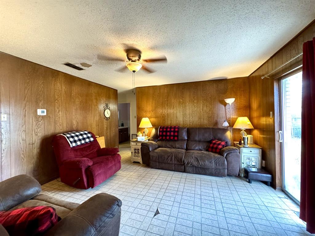 317 North Trail Street Crowley, TX 76036 - Photo 7 of 35 a living room with furniture and a lamp