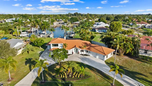 an aerial view of residential houses with outdoor space and street view