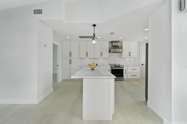 a kitchen with a sink and a window