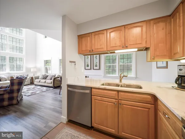 a kitchen with stainless steel appliances granite countertop a stove microwave and sink