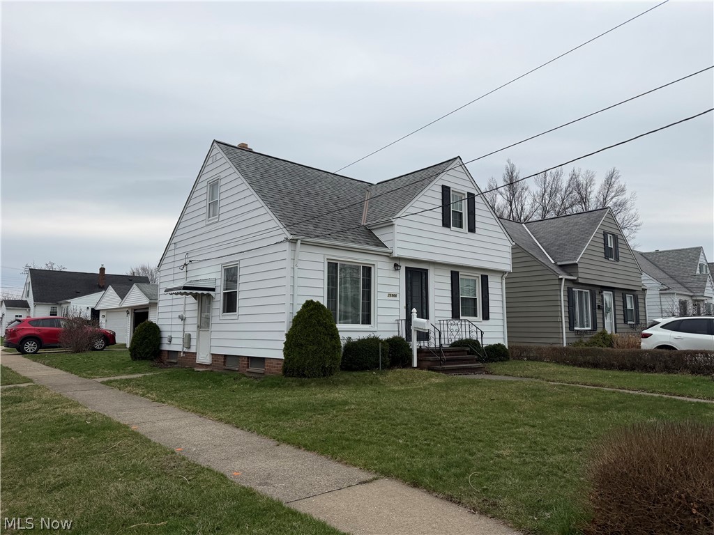 29966 Elgin Road Wickliffe, OH 44092 - Photo 1 of 1 View of front of property featuring roof with shingles and a front yard