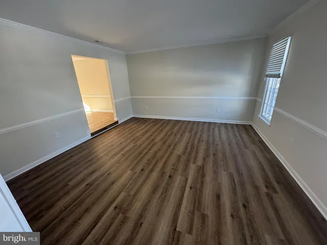 a view of wooden floor in an empty room