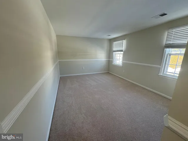 a view of empty room with windows