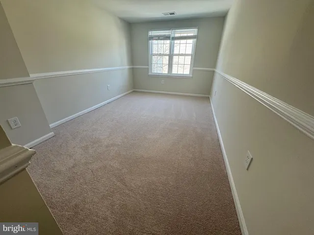 a view of empty room with windows