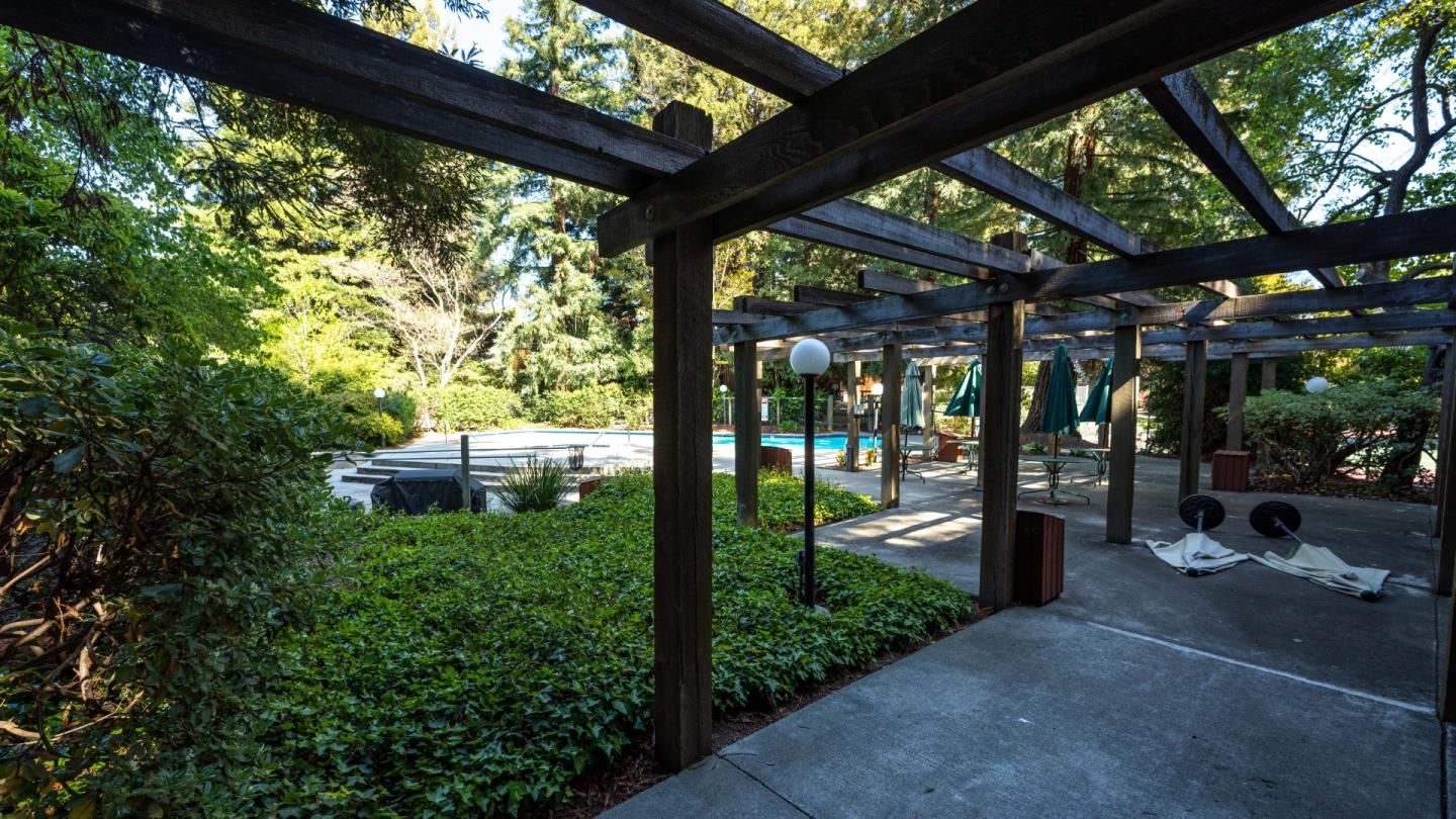 220 Central Avenue Mountain View, CA 94043 - Photo 21 of 22 a backyard of a house with a fountain swing table and chairs