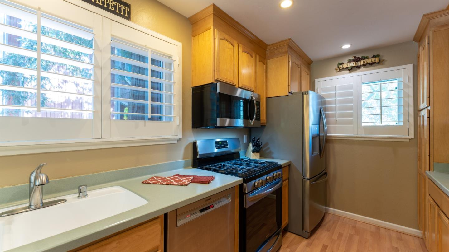 220 Central Avenue Mountain View, CA 94043 - Photo 6 of 22 a kitchen with a sink stove and refrigerator