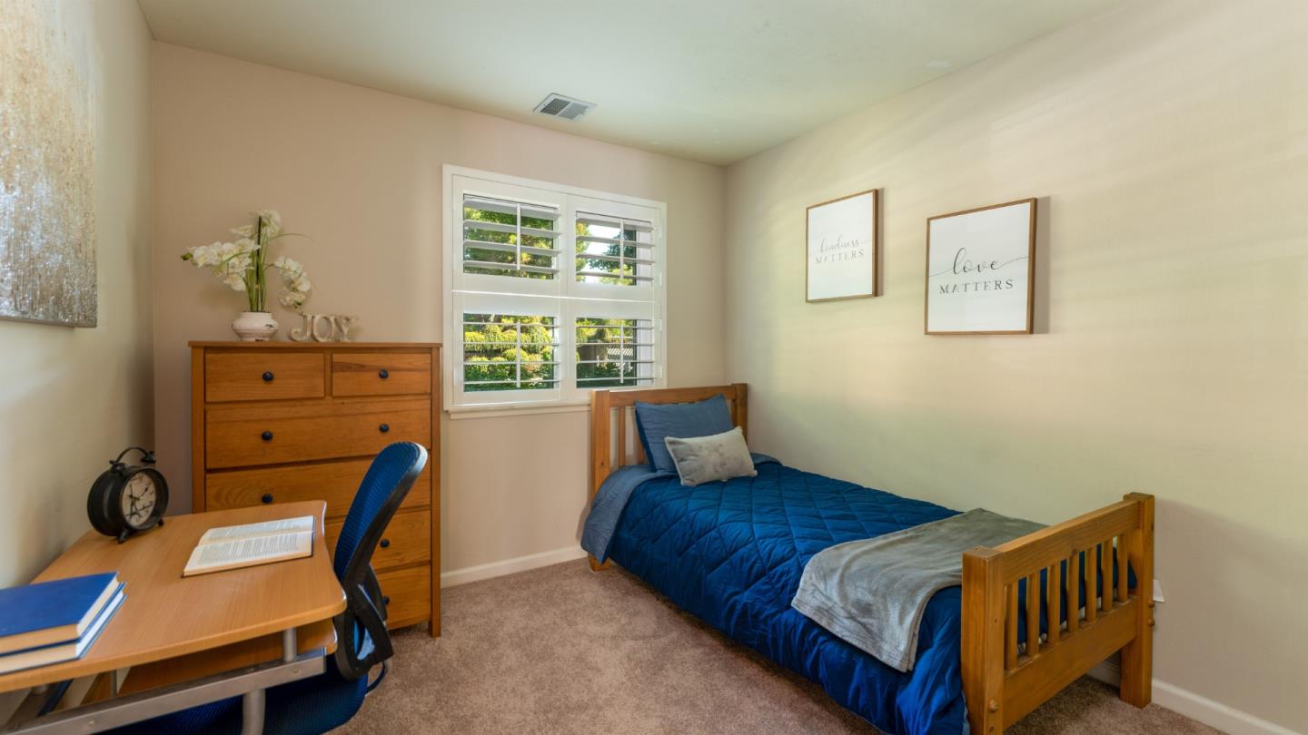 220 Central Avenue Mountain View, CA 94043 - Photo 7 of 22 a bedroom with a bed and wooden floor