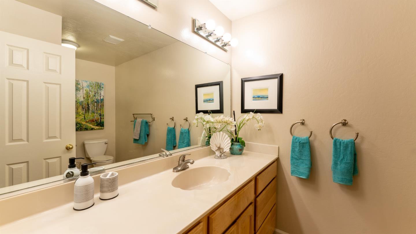 220 Central Avenue Mountain View, CA 94043 - Photo 8 of 22 a bathroom with a sink vanity and a mirror