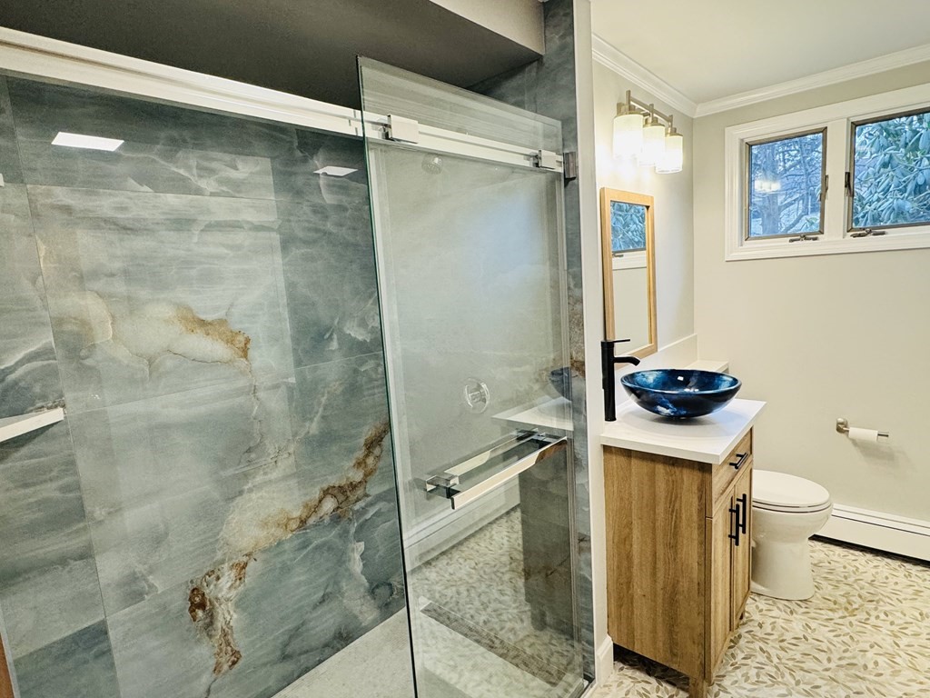 10 Robert Road Framingham, MA 01702 - Photo 12 of 20 a bathroom with a sink a toilet and shower