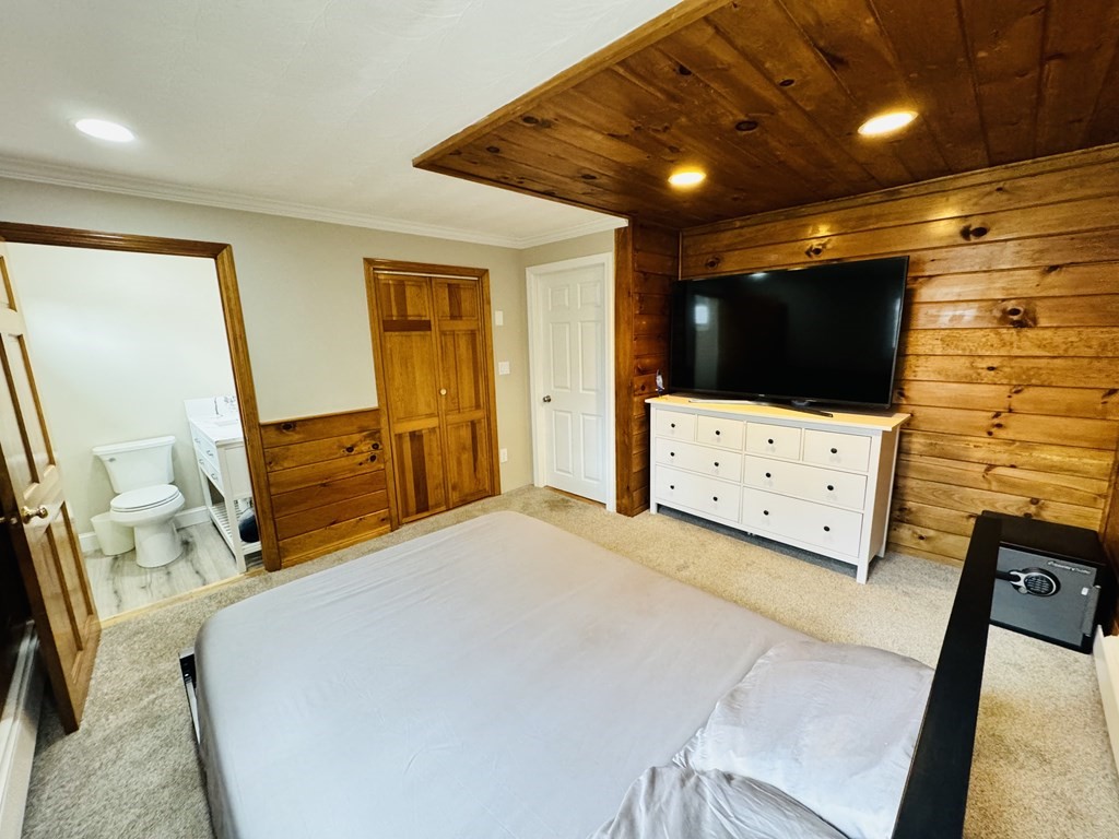 10 Robert Road Framingham, MA 01702 - Photo 13 of 20 a bedroom with furniture and a flat screen tv