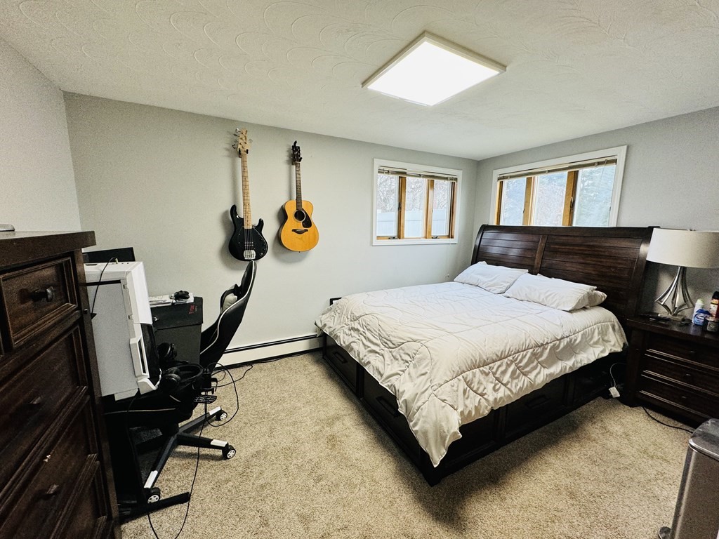 10 Robert Road Framingham, MA 01702 - Photo 15 of 20 a bedroom with a bed a dresser and a window