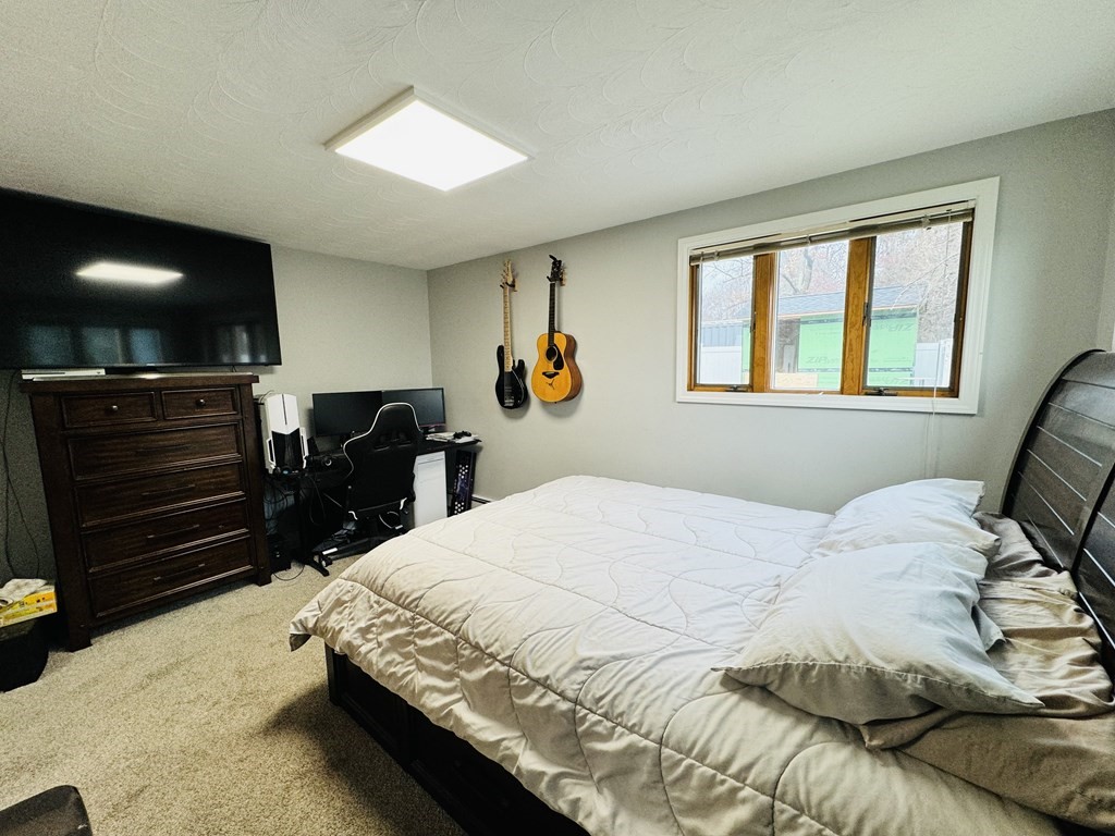 10 Robert Road Framingham, MA 01702 - Photo 16 of 20 a bedroom with a bed and a dresser
