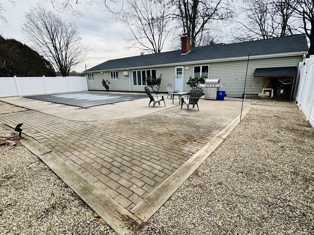 10 Robert Road Framingham, MA 01702 - Photo 20 of 20 a view of a house with a bench