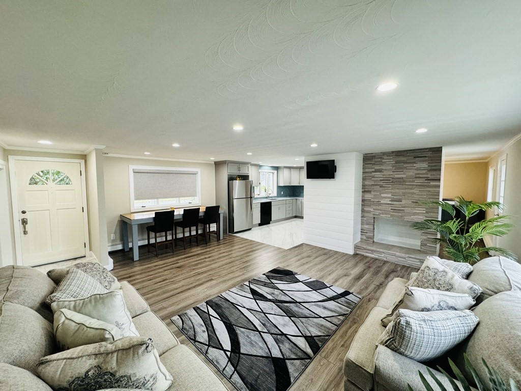 10 Robert Road Framingham, MA 01702 - Photo 4 of 20 a living room with furniture and a table