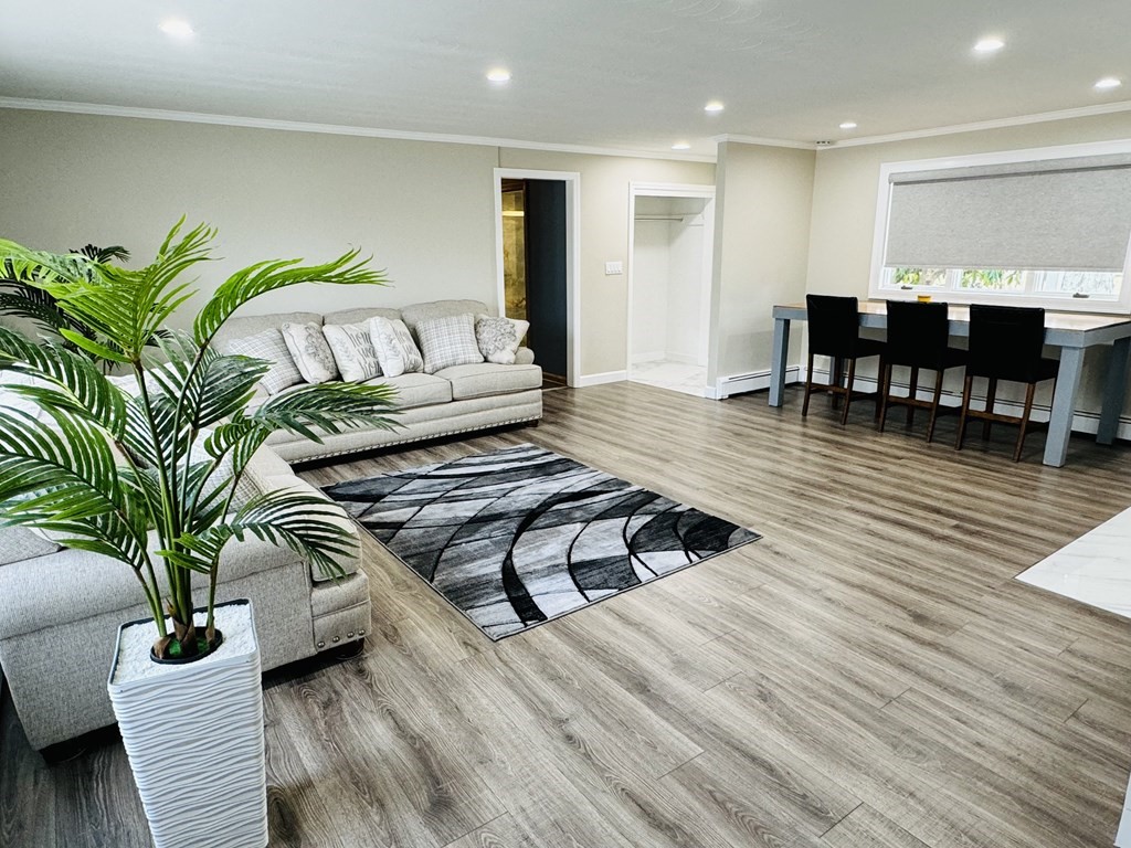 10 Robert Road Framingham, MA 01702 - Photo 6 of 20 a living room with furniture and wooden floor