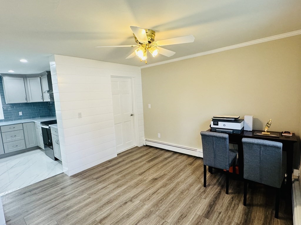 10 Robert Road Framingham, MA 01702 - Photo 10 of 20 a view of a workspace with furniture and wooden floor