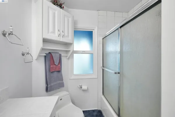 a bathroom with a bathtub and shower
