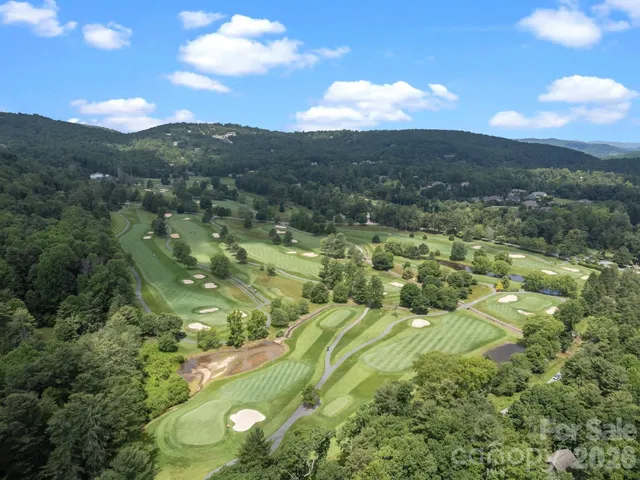 a front view of a house with a yard table and chairs