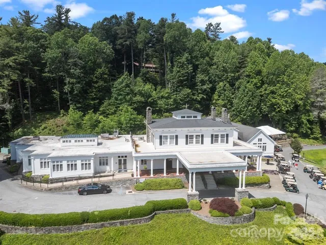 a view of a swimming pool with a yard