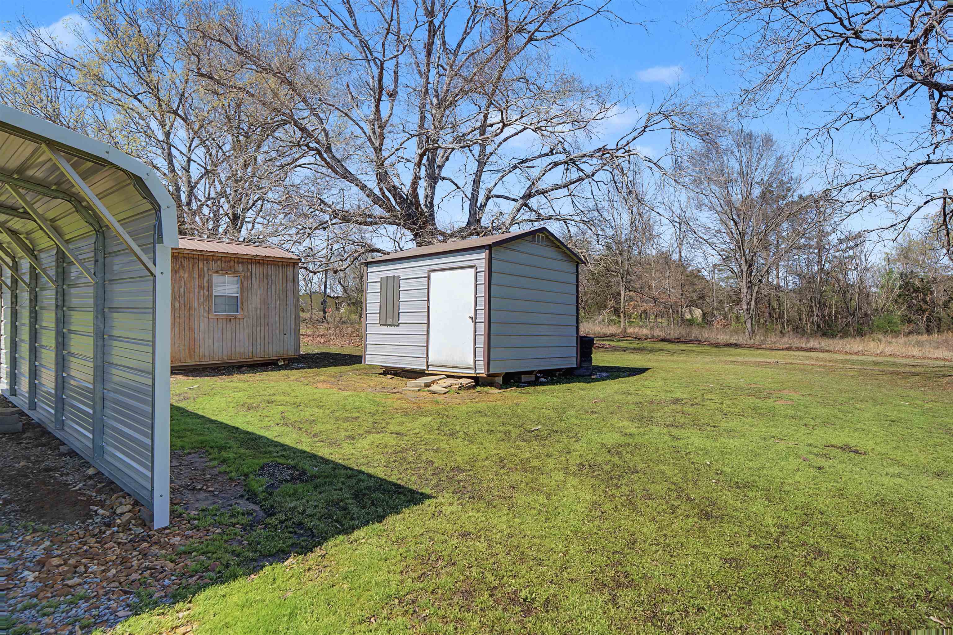 1788 Nichols Road Guys, TN 38339 - Photo 7 of 21 View of green lawn featuring a storage unit