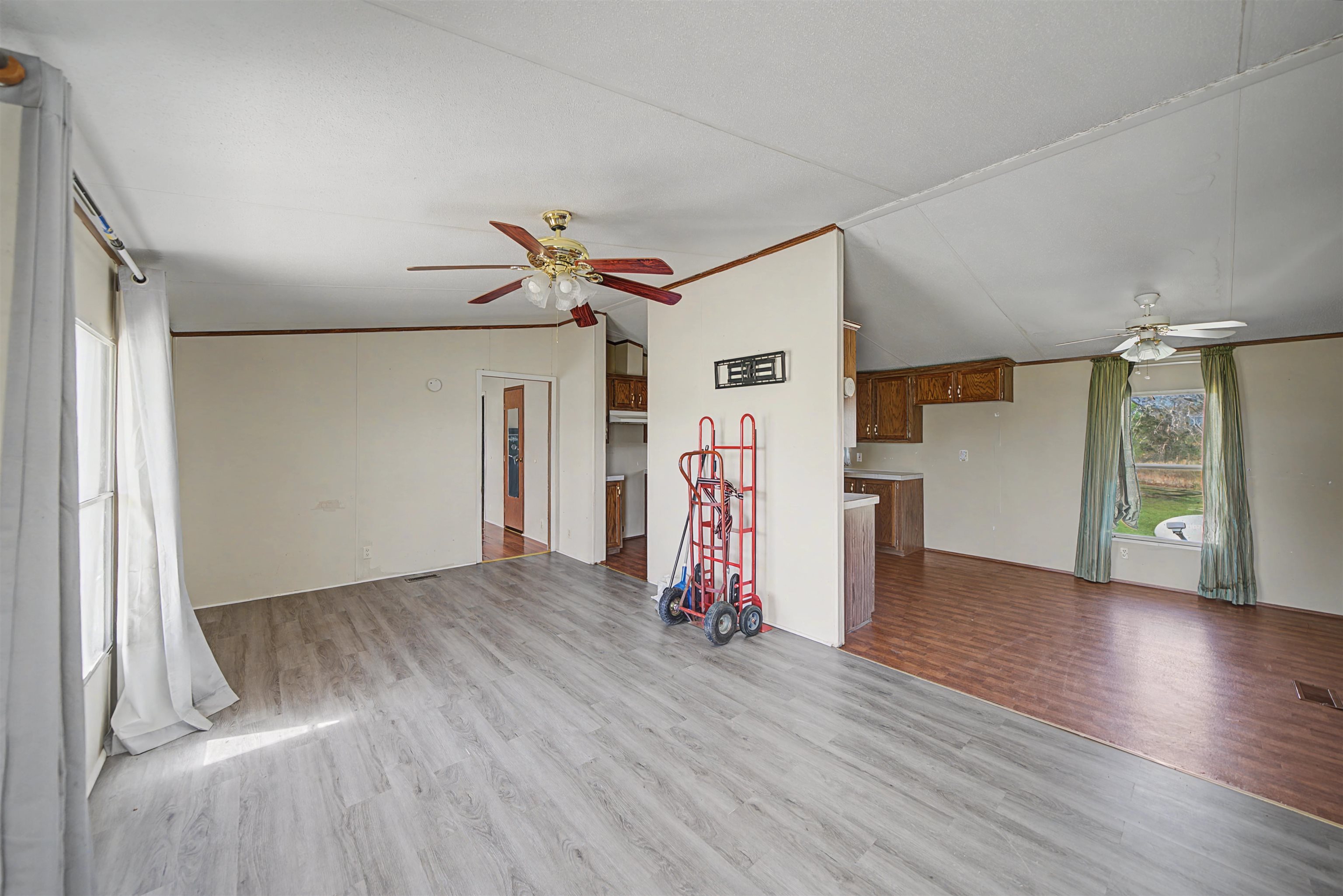 1788 Nichols Road Guys, TN 38339 - Photo 10 of 21 Unfurnished living room featuring a ceiling fan, lofted ceiling, and light wood-style floors
