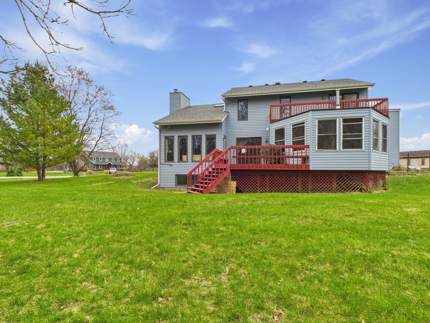 15840 Overlook Lane Huntley, IL 60142 - Photo 28 of 42 a front view of house with yard and green space