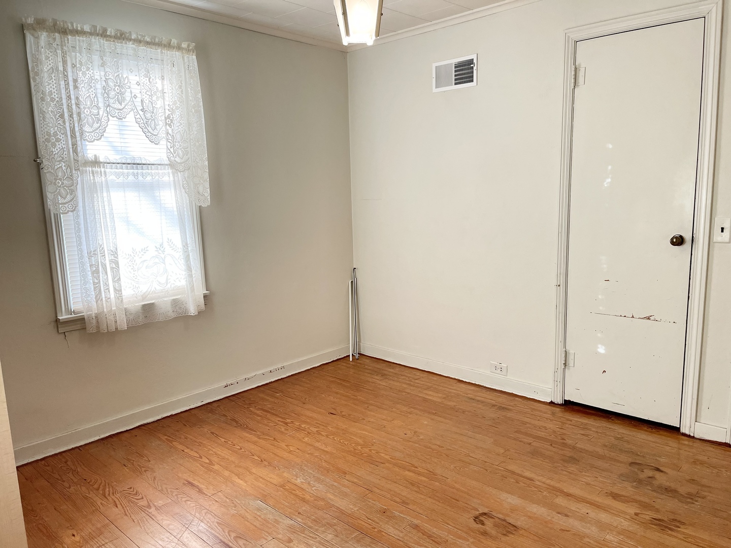 735 3rd Avenue Ottawa, IL 61350 - Photo 11 of 18 an empty room with wooden floor and windows