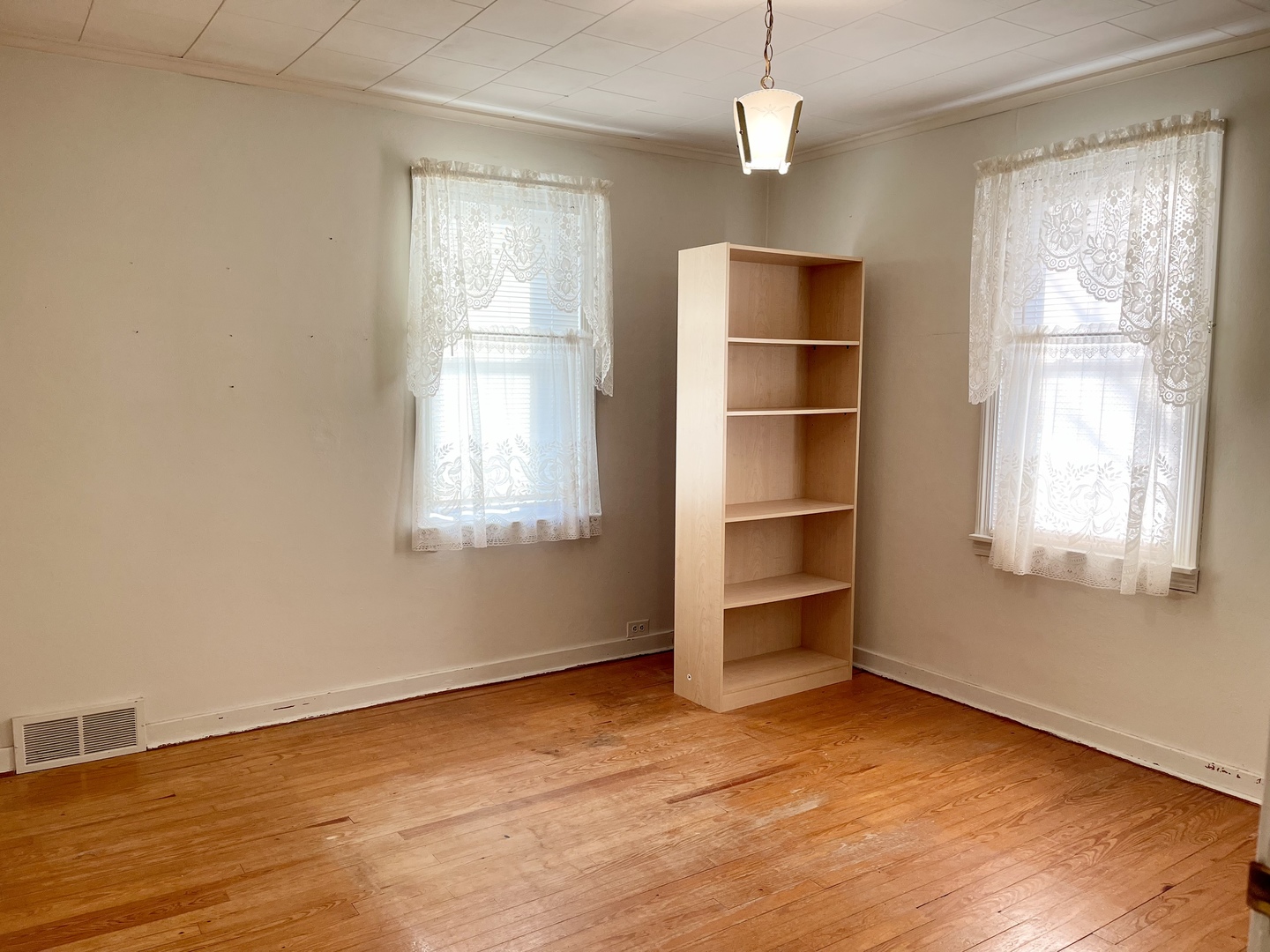 735 3rd Avenue Ottawa, IL 61350 - Photo 12 of 18 a view of an empty room with a window and wooden floor