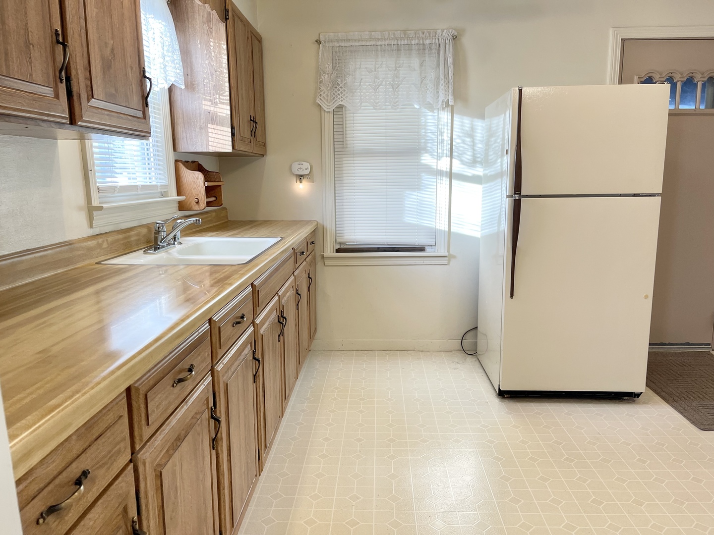 735 3rd Avenue Ottawa, IL 61350 - Photo 4 of 18 a kitchen with a refrigerator a sink and dishwasher