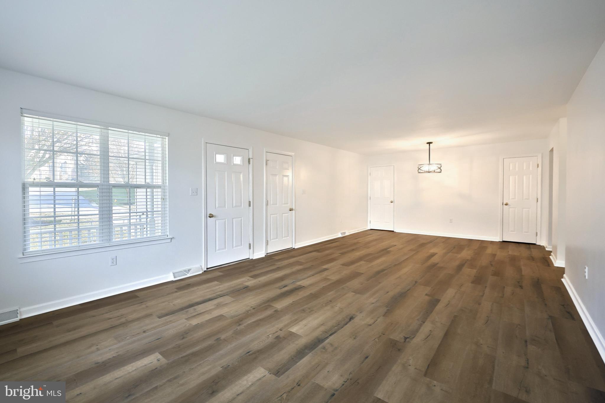 7220 Seneca Ridge Drive York, PA 17403 - Photo 10 of 51 a view of empty room with wooden floor and fan