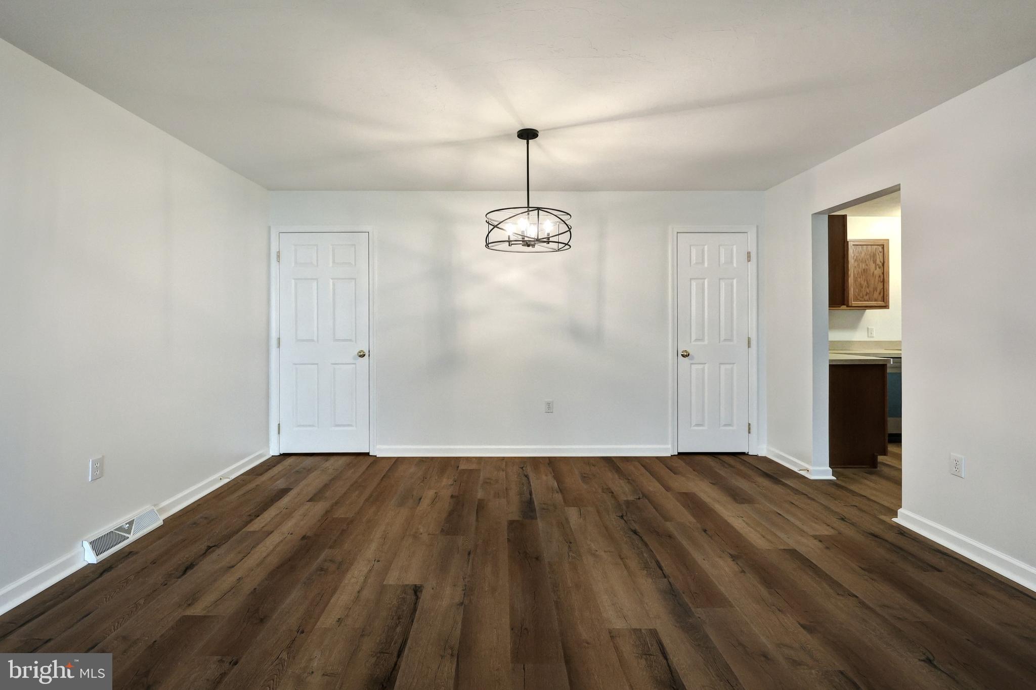 7220 Seneca Ridge Drive York, PA 17403 - Photo 11 of 51 a view of empty room with wooden floor and fan