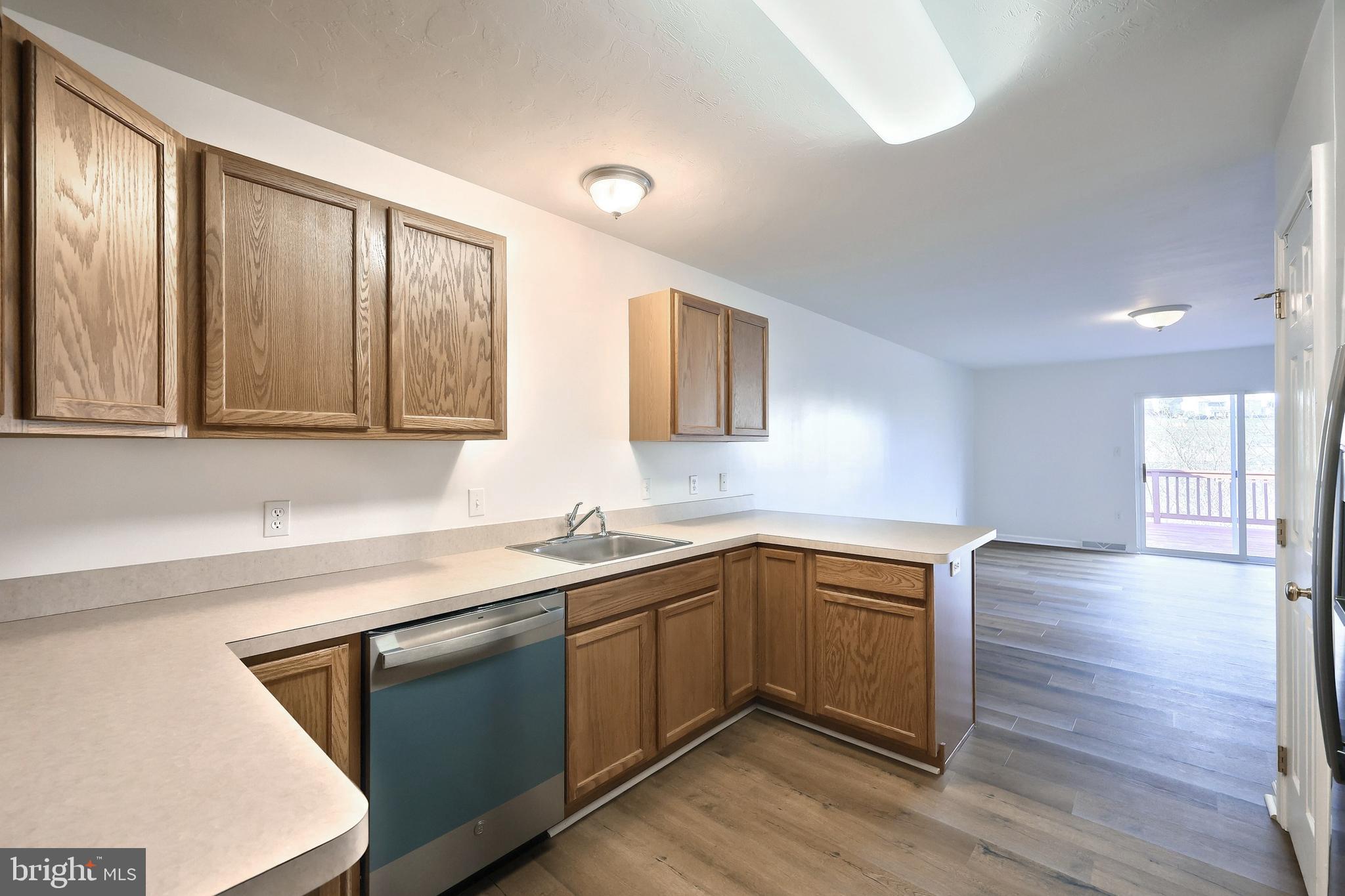 7220 Seneca Ridge Drive York, PA 17403 - Photo 15 of 51 a kitchen with a sink cabinets and wooden floor