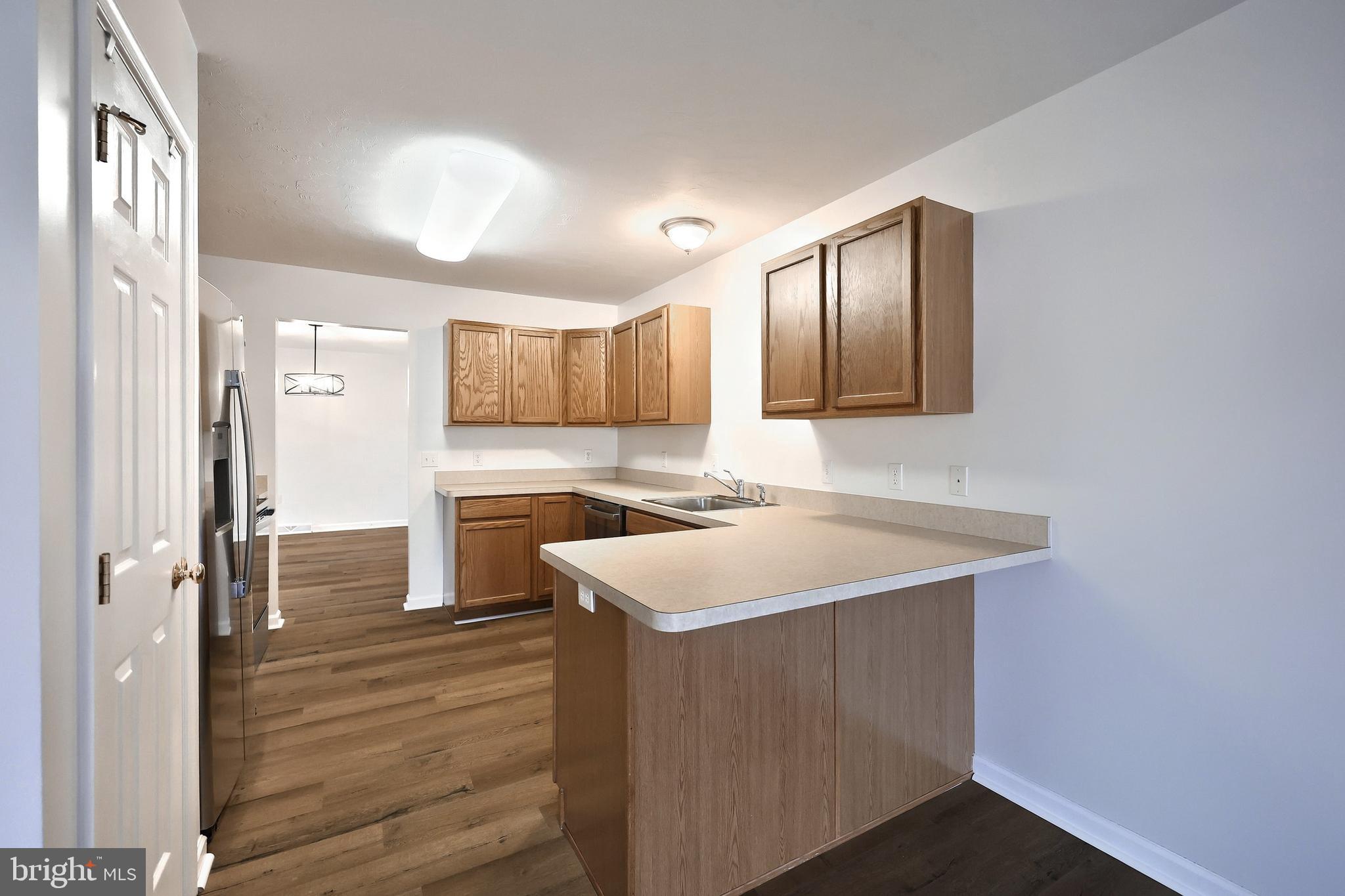 7220 Seneca Ridge Drive York, PA 17403 - Photo 16 of 51 a kitchen with a sink stove and refrigerator