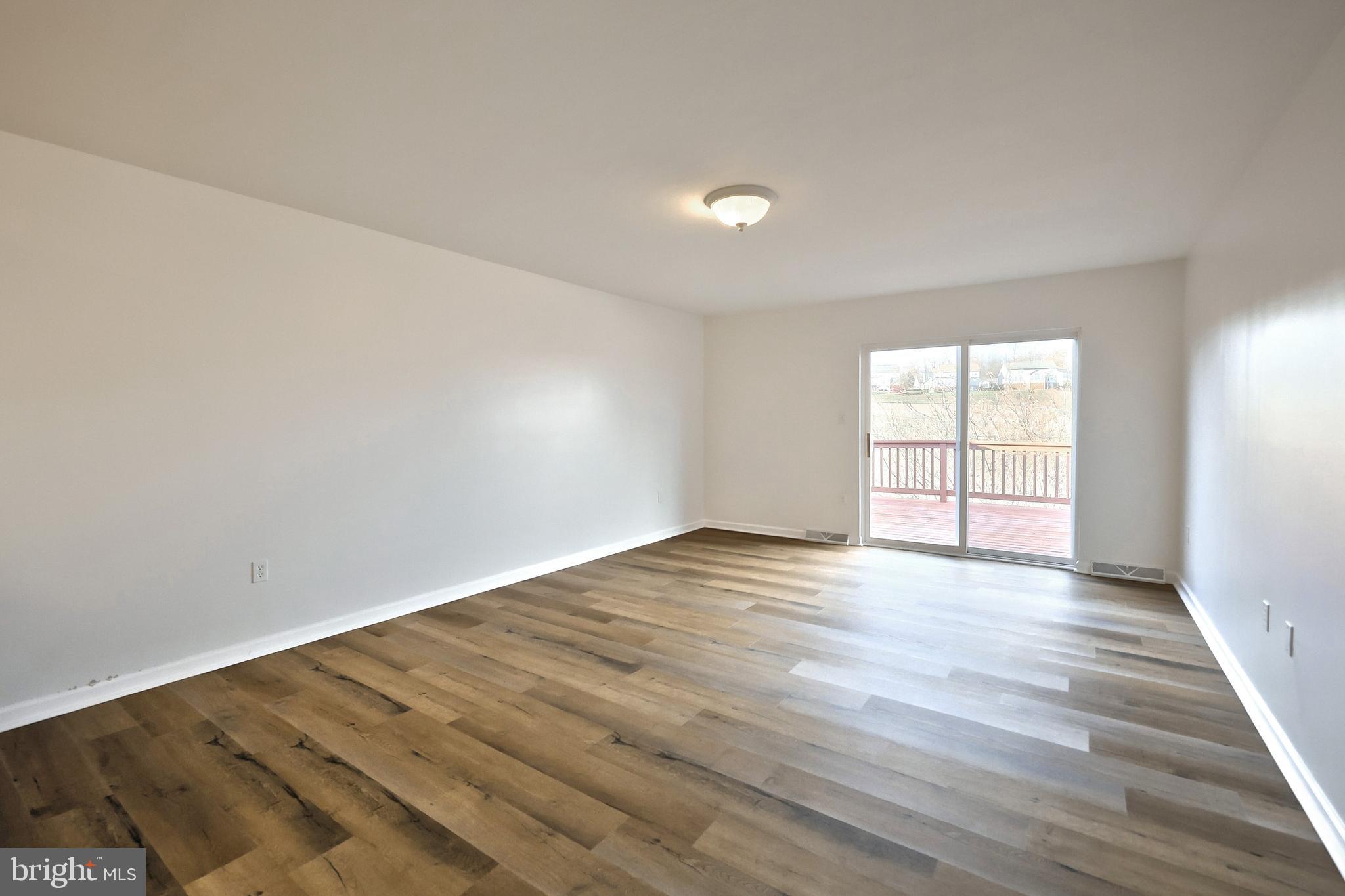 7220 Seneca Ridge Drive York, PA 17403 - Photo 20 of 51 wooden floor in an empty room with a window