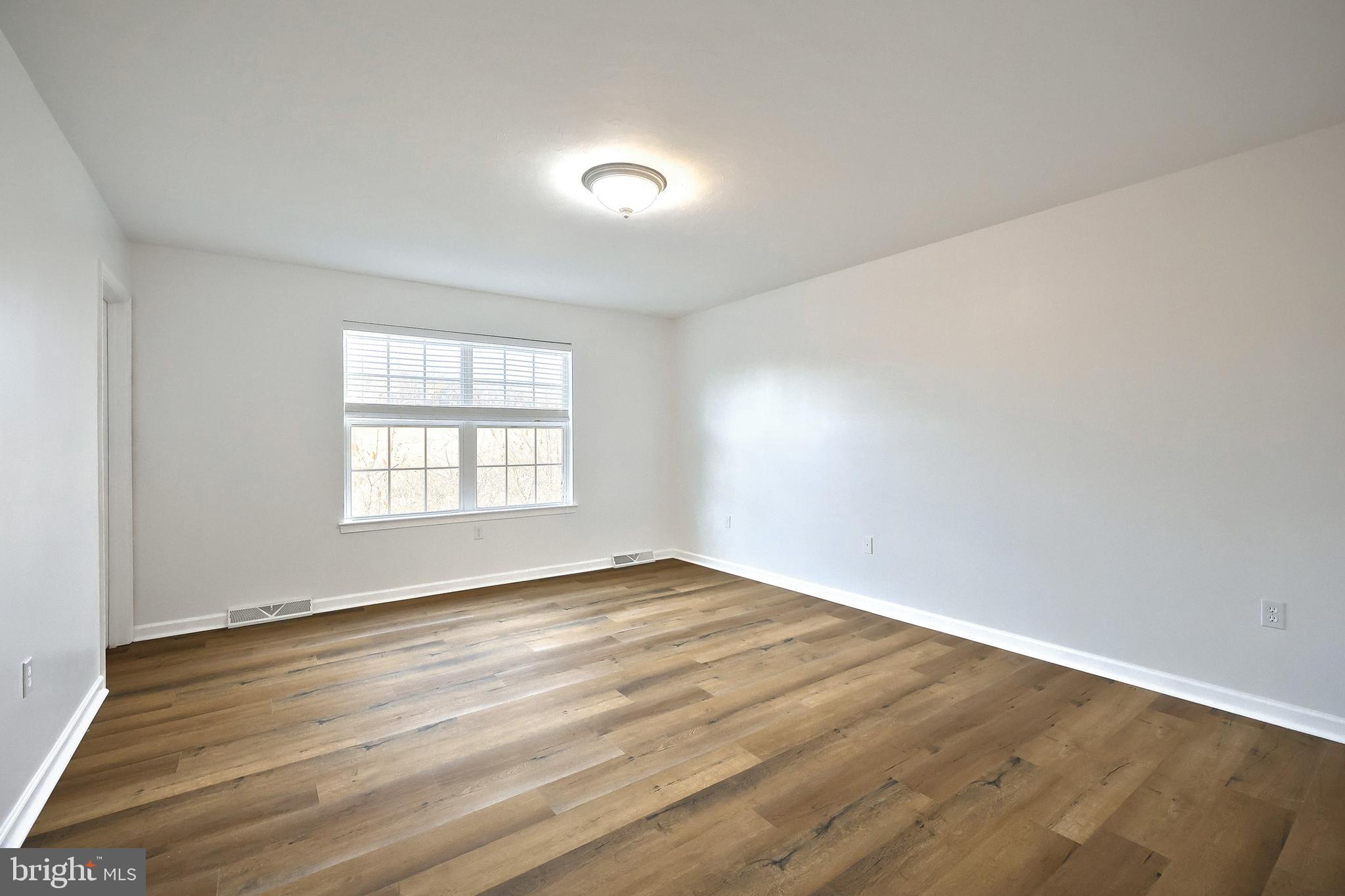 7220 Seneca Ridge Drive York, PA 17403 - Photo 30 of 51 wooden floor in an empty room with a window