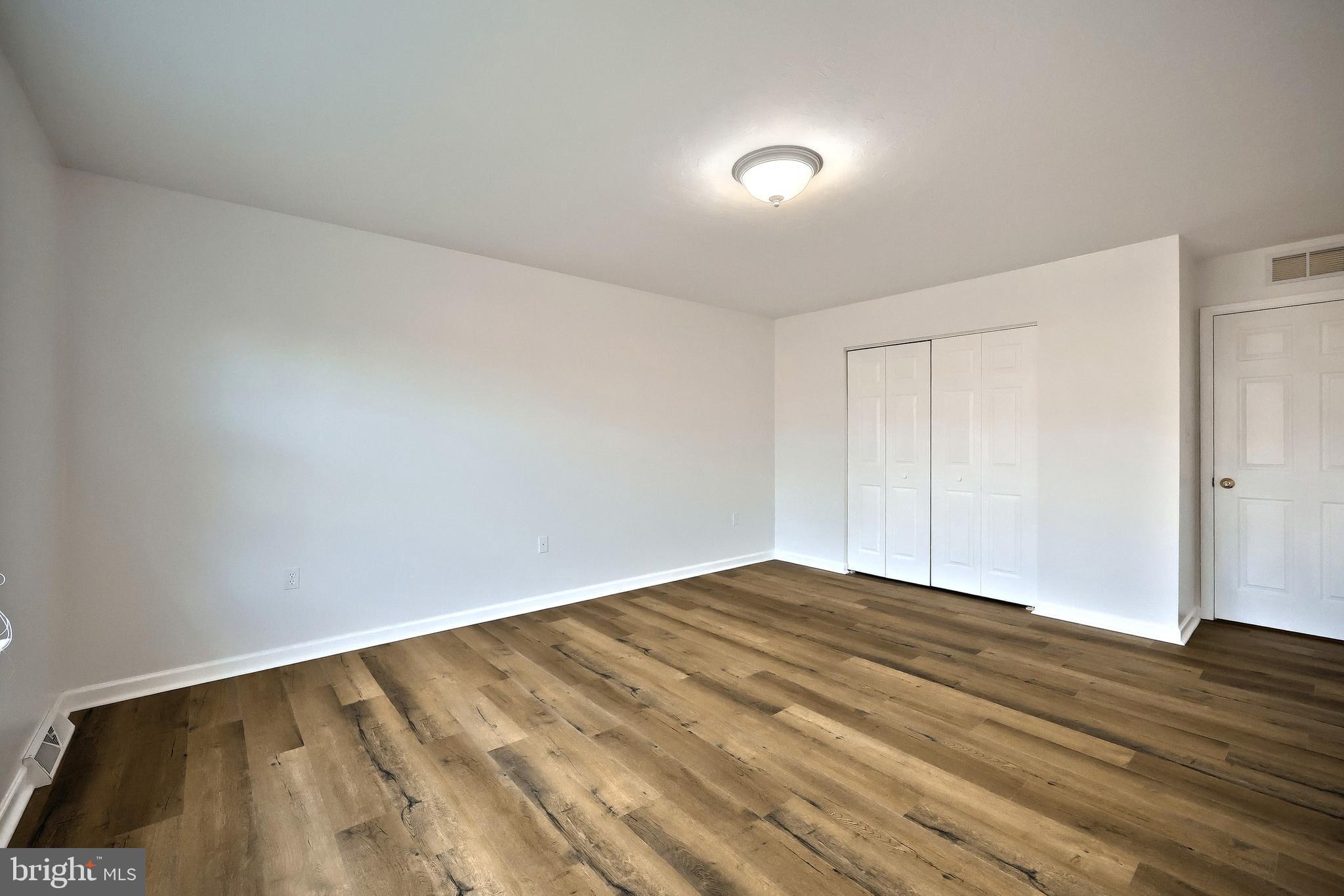 7220 Seneca Ridge Drive York, PA 17403 - Photo 31 of 51 a view of empty room with wooden floor