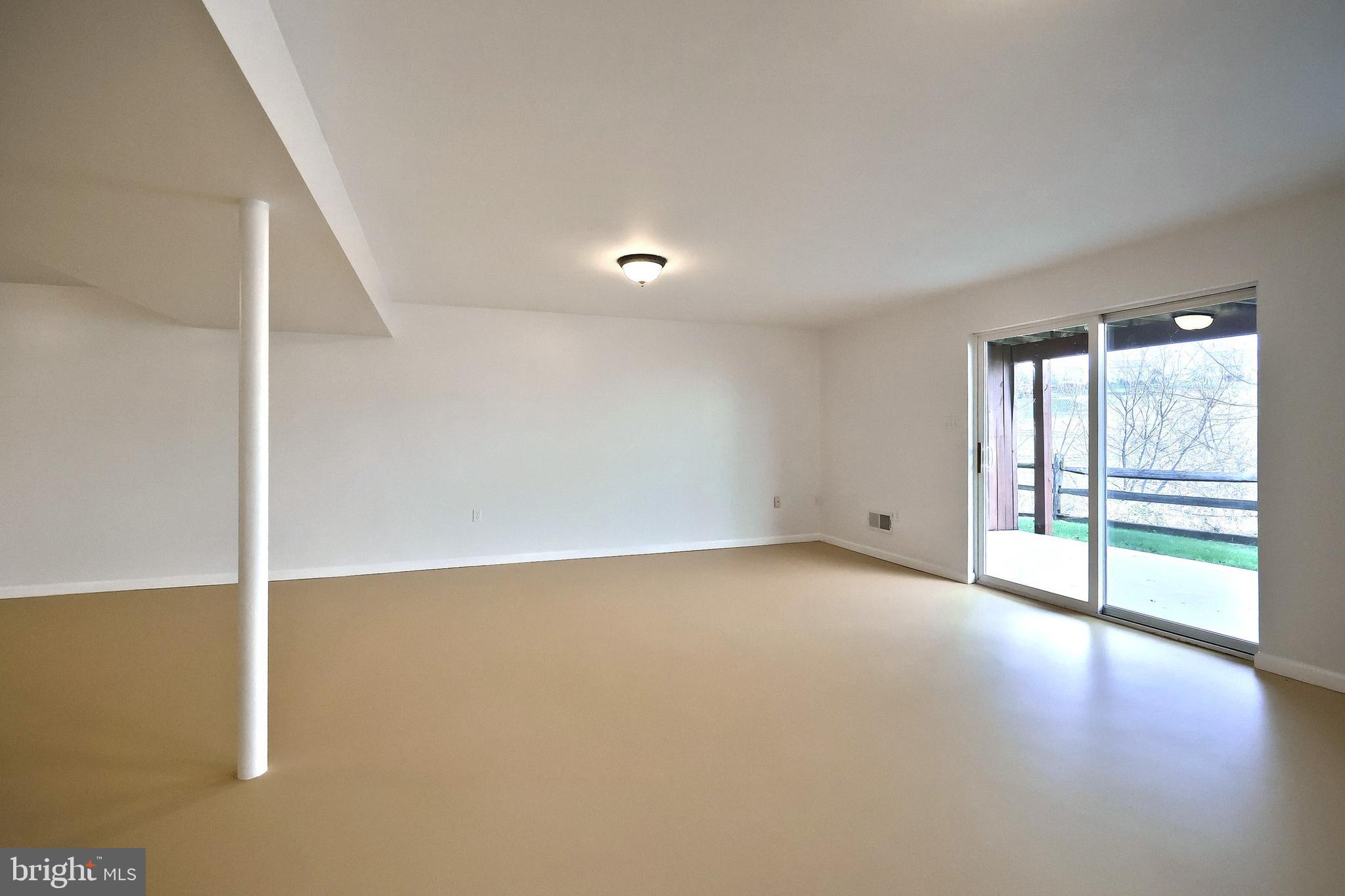 7220 Seneca Ridge Drive York, PA 17403 - Photo 37 of 51 an empty room with wooden floor and windows