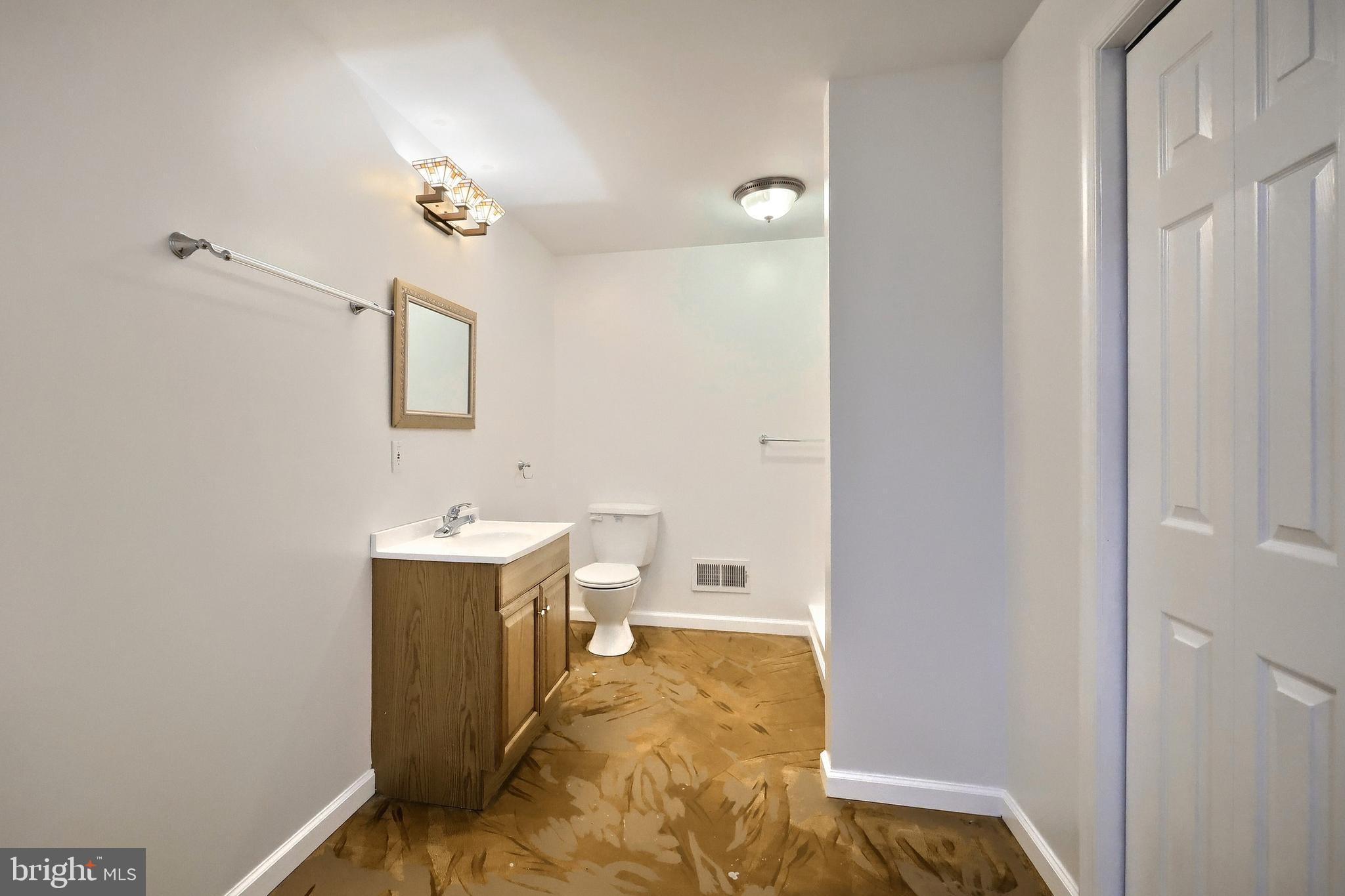 7220 Seneca Ridge Drive York, PA 17403 - Photo 41 of 51 a view of a bathroom with a sink and mirror