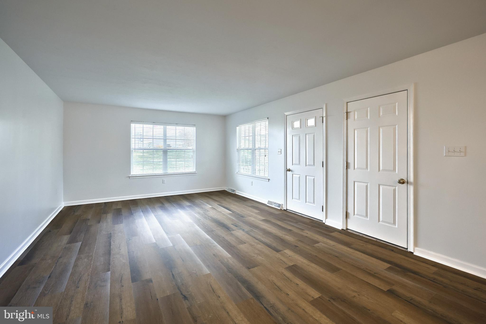7220 Seneca Ridge Drive York, PA 17403 - Photo 8 of 51 an empty room with wooden floor and windows