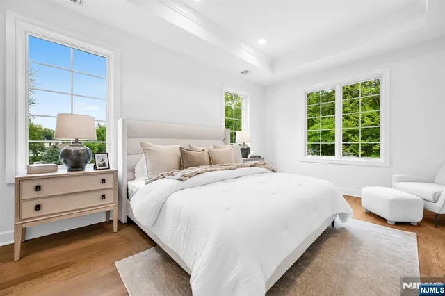 a bedroom with bed and window